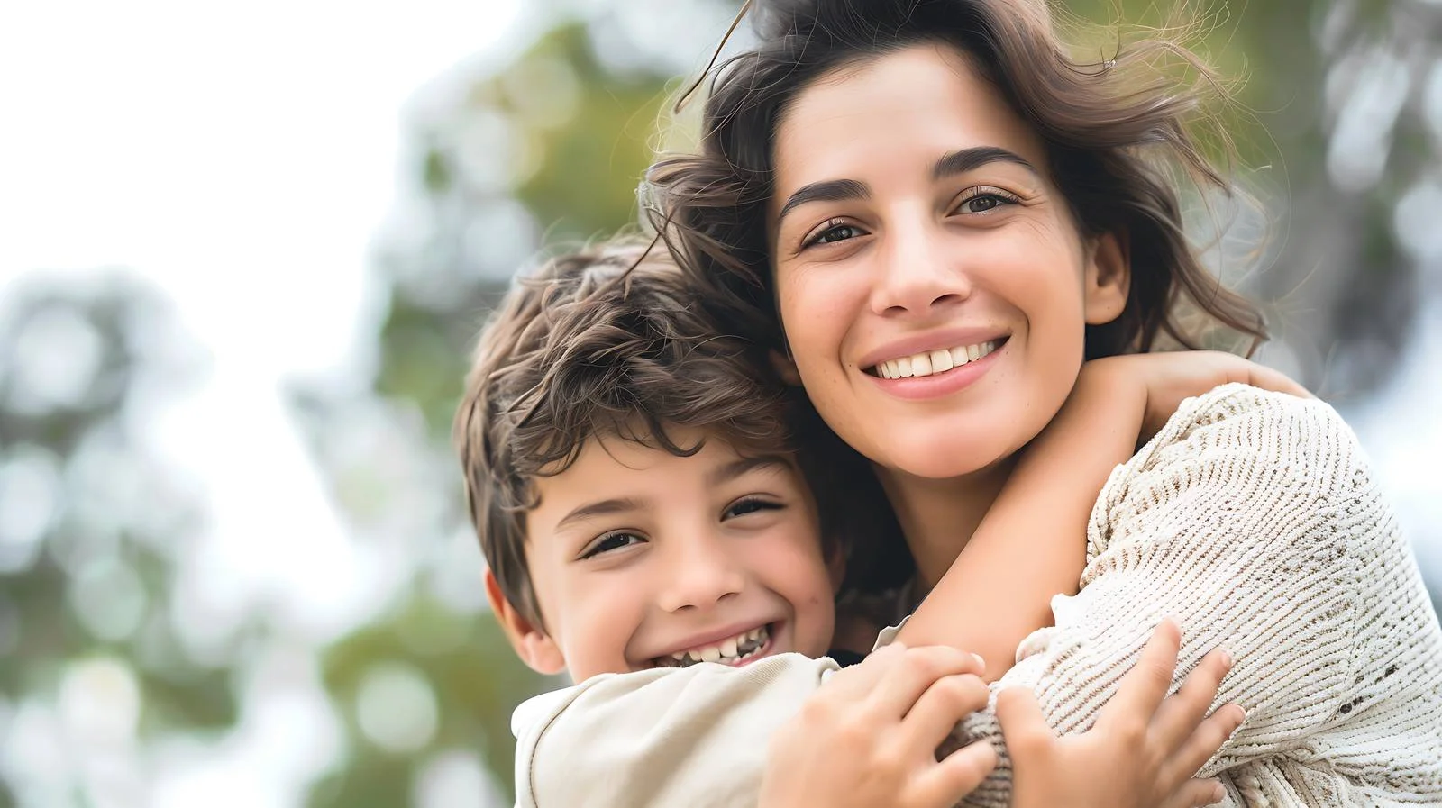 Joyful Mother Embracing Son Outdoors — free download from Dotvec