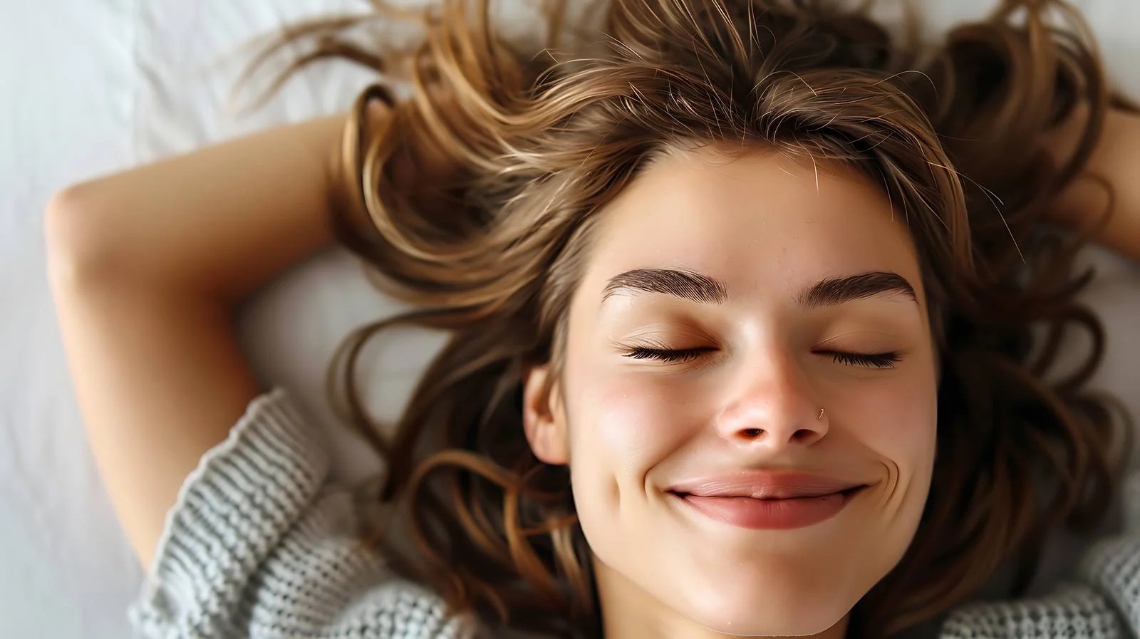 Tranquil Young Woman Relaxing on Bed — free download from Dotvec