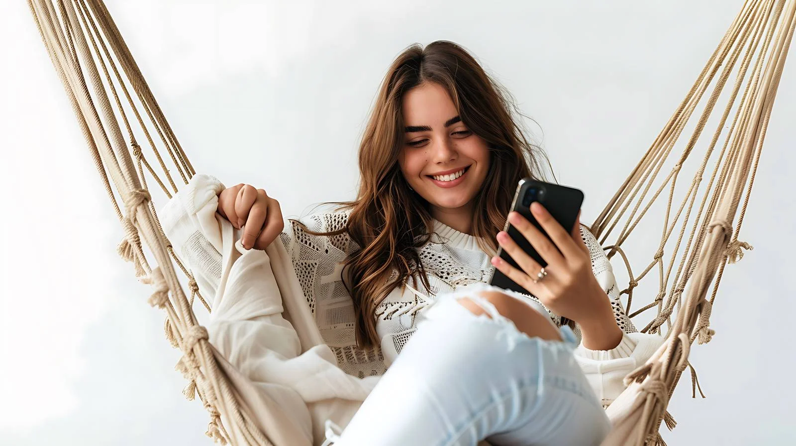 Young Woman Using Mobile Phone Outdoors — free download from Dotvec