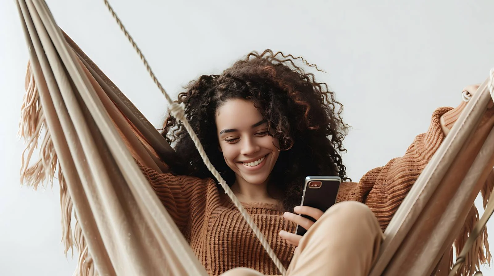Young Woman Resting and Using Mobile Phone — free download from Dotvec