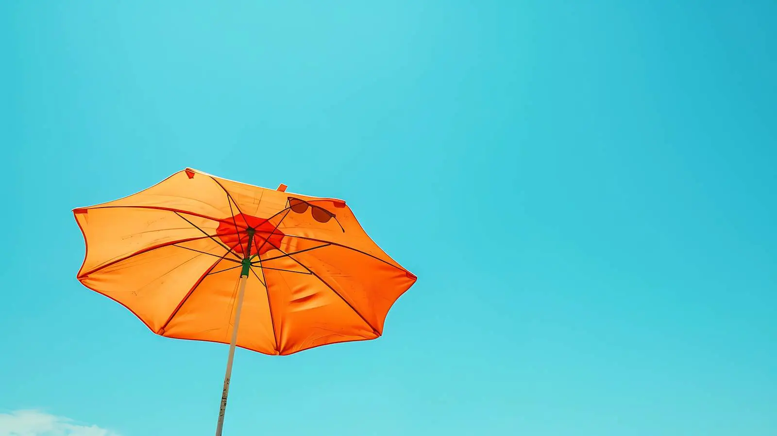 Sunglasses and Beach Umbrella under Blue Sky – free enjoyment image from Dotvec