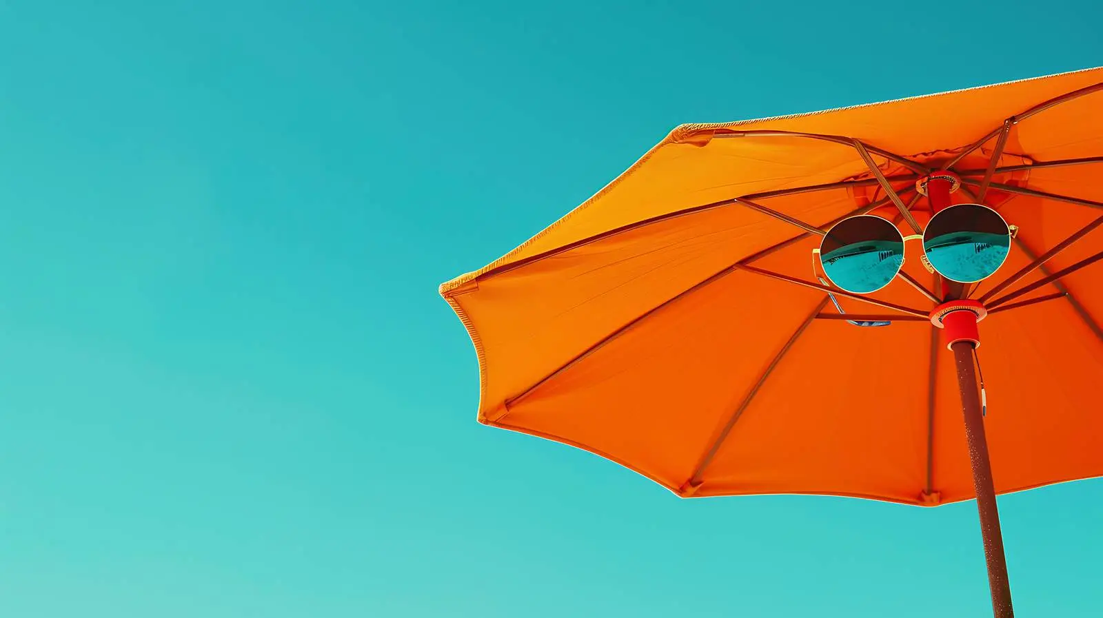 Sunglasses and Beach Umbrella Under Blue Sky — free download from Dotvec