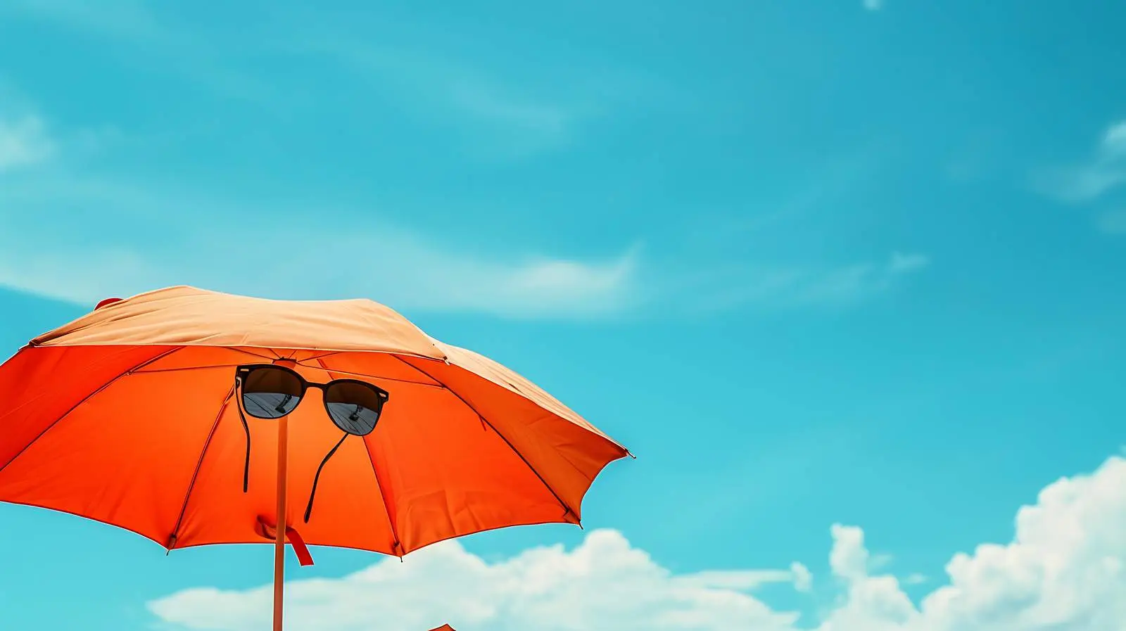 Sunglasses and Beach Umbrella Under Blue Sky — free download from Dotvec