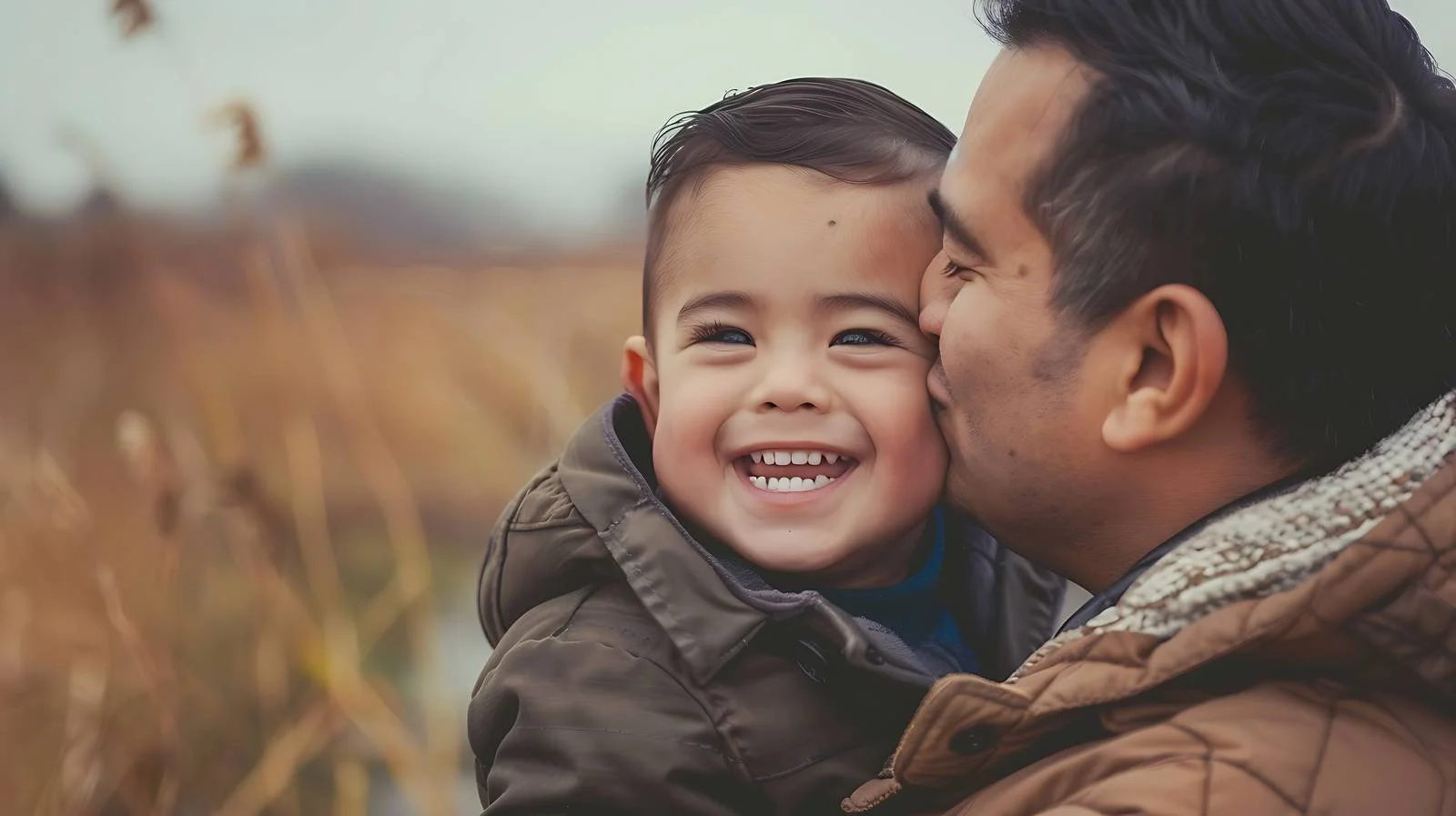 Joyful Toddler Smiling as Dad Kisses — free download from Dotvec