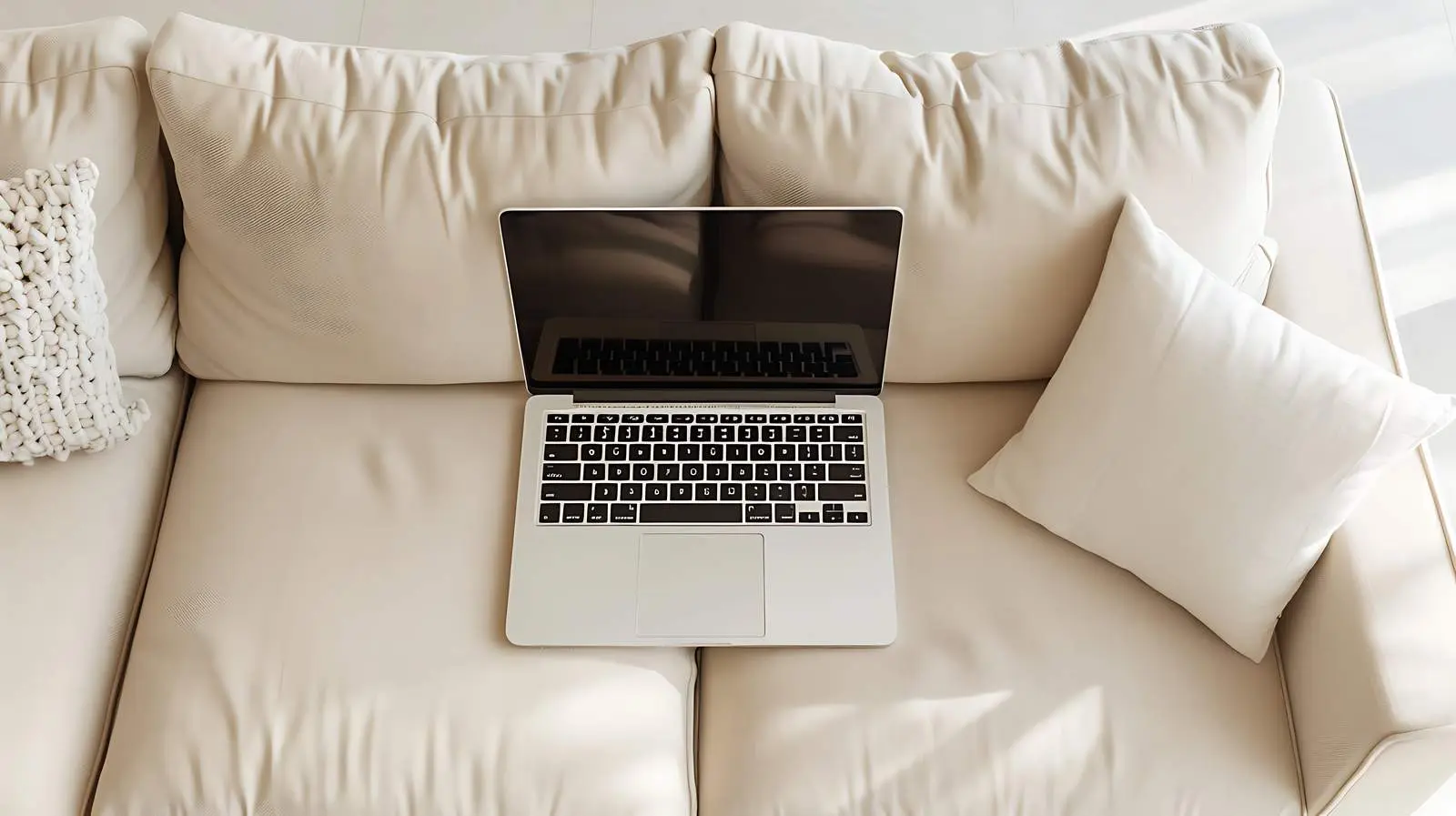 Laptop on Beige Couch with Pillows — free download from Dotvec