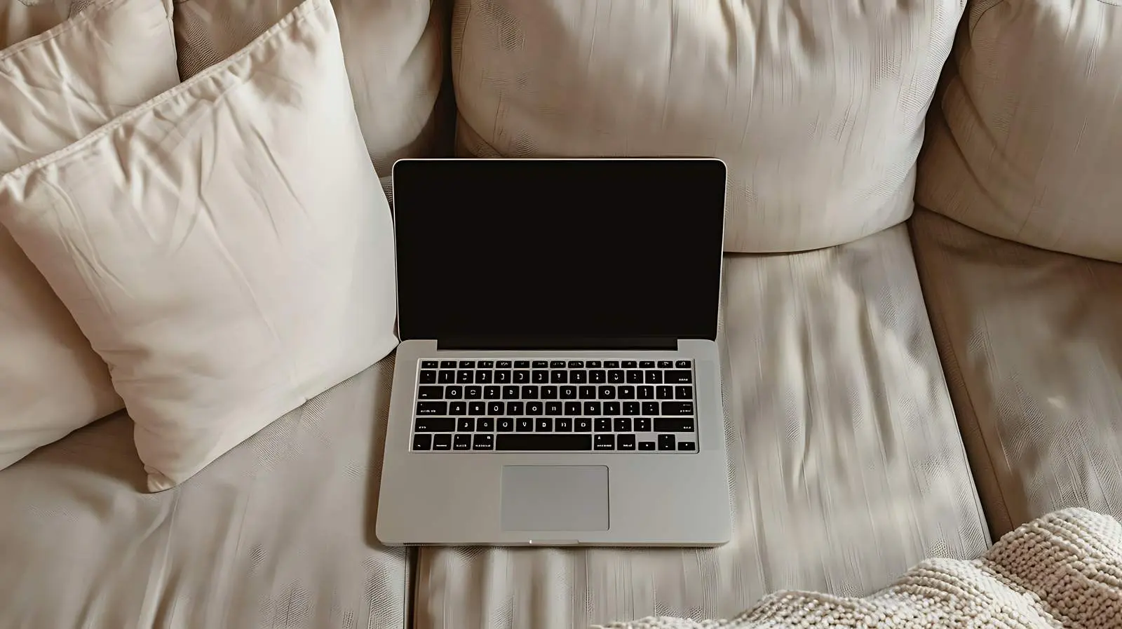 Laptop on Beige Couch with Pillows — free download from Dotvec