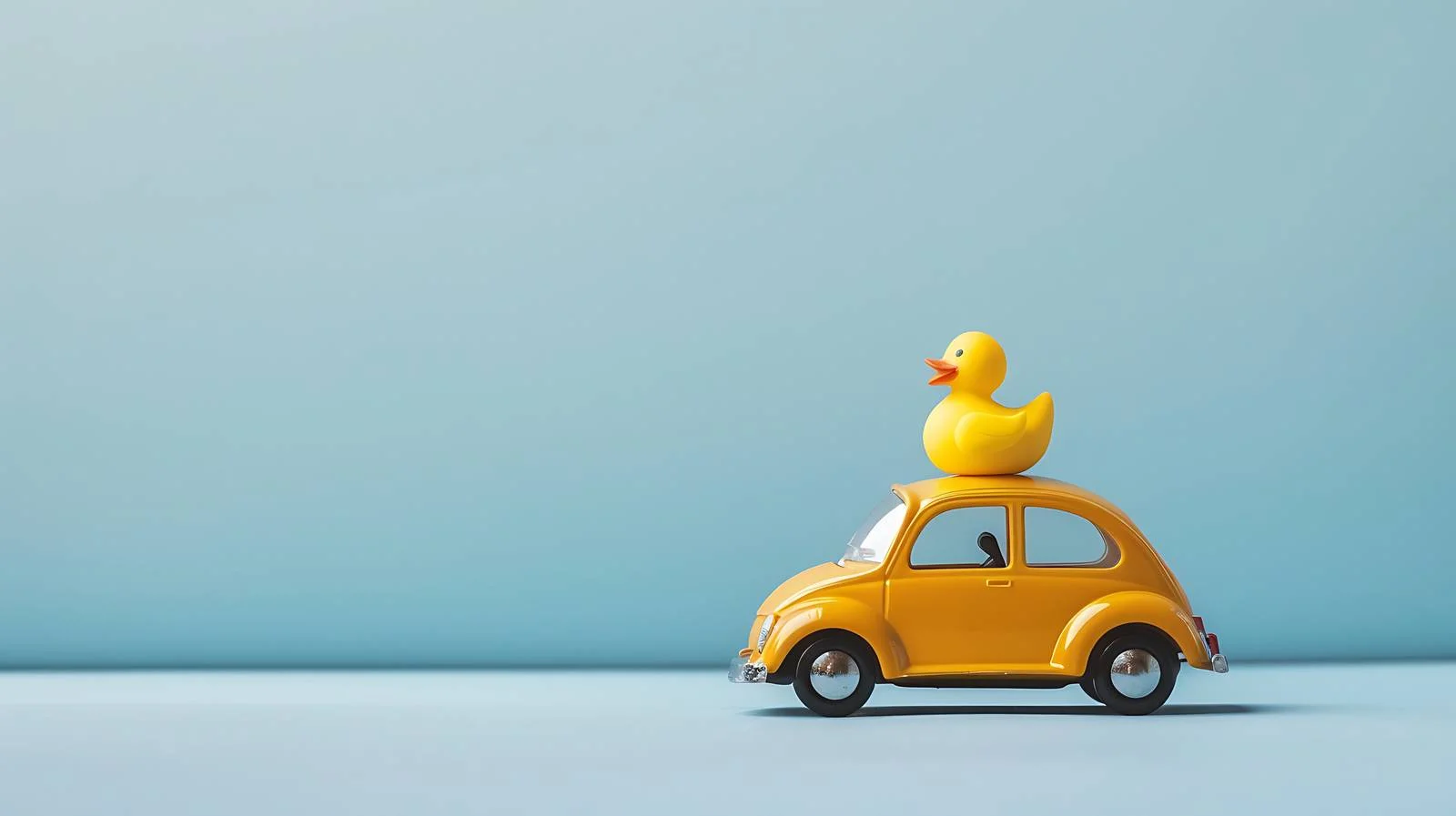 Toy Car and Yellow Rubber Duck — free download from Dotvec