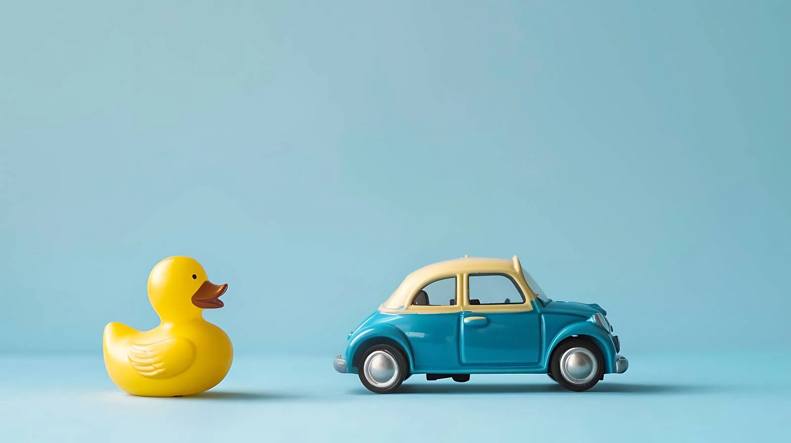 Playful Toy Car and Duck on Blue — free download from Dotvec