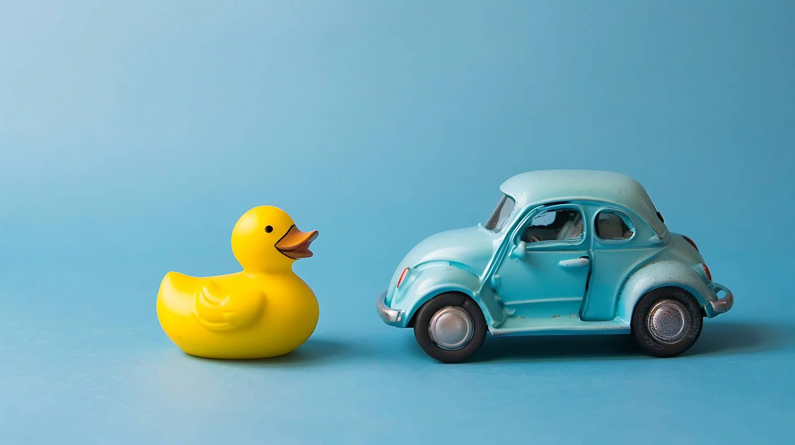 Colorful Toy Car and Duck on Blue — free download from Dotvec