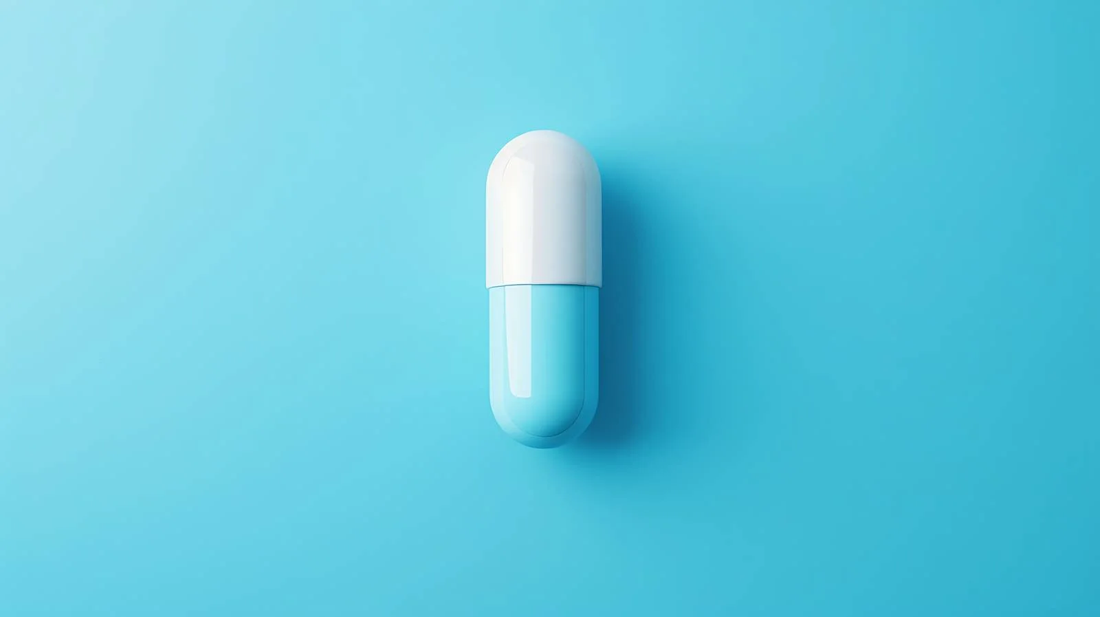 Blue Pill Capsule on Minimal Blue Background — free download from Dotvec