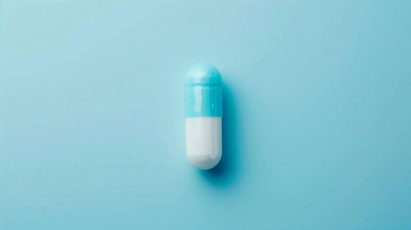Medical Capsule on Blue Background — free download from Dotvec