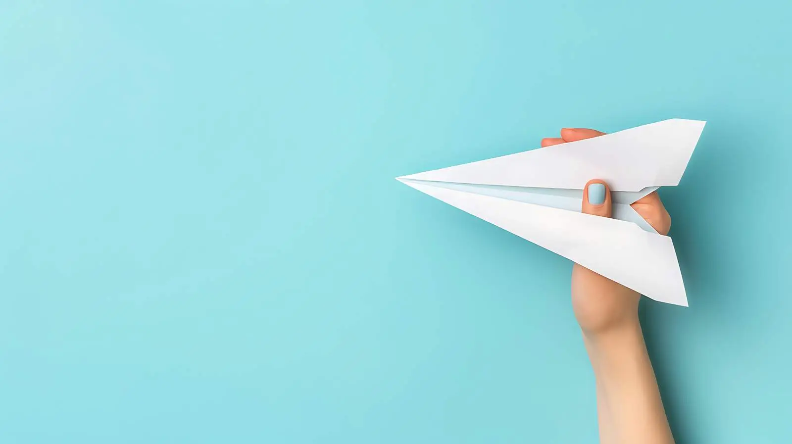 Woman Holding White Paper Plane on Pale Blue Background — free download from Dotvec