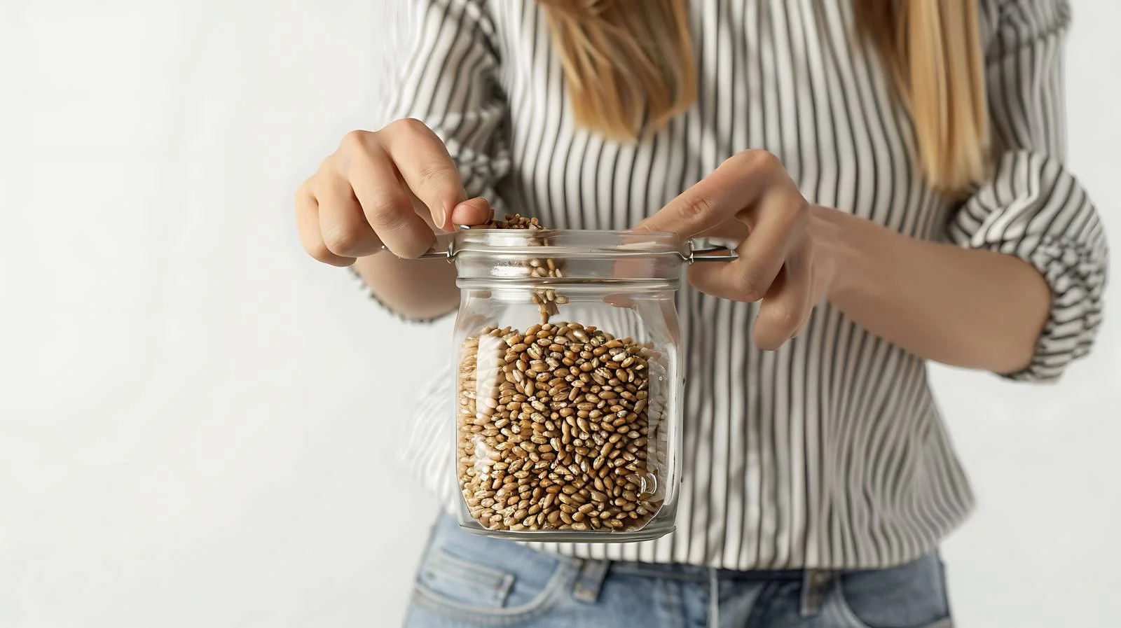 Businesswoman Filling Grain in Glass Jar — free download from Dotvec