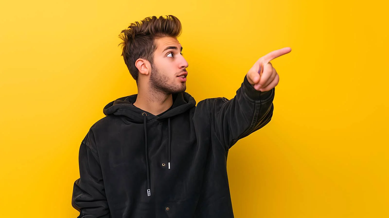 Young Man Pointing Yellow Background — free download from Dotvec