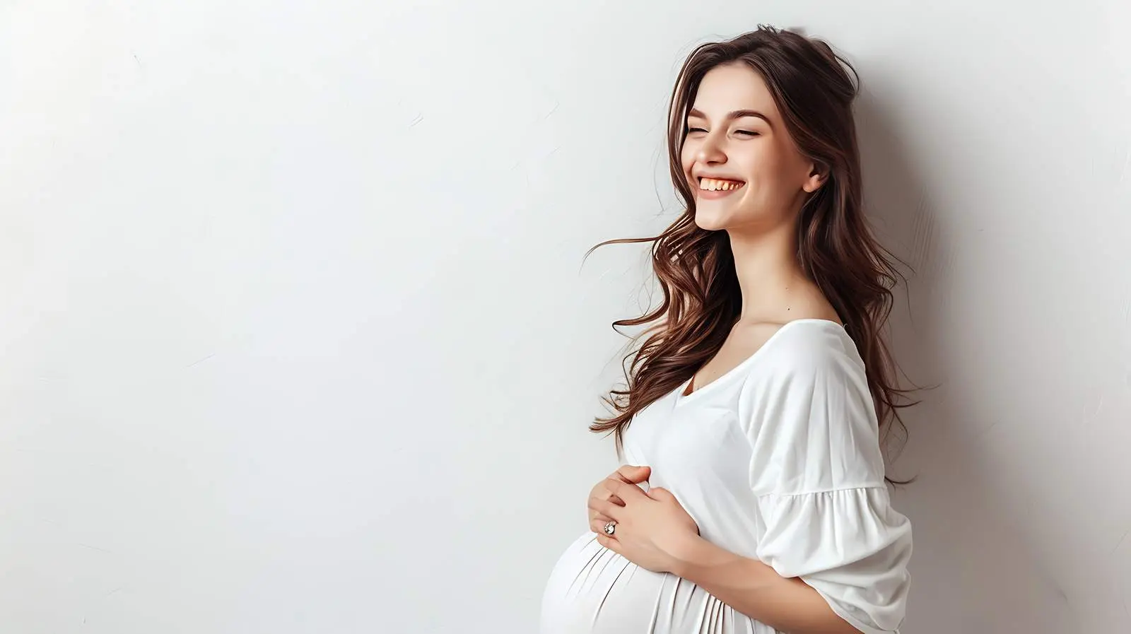 Pregnant Woman Posing by White Wall – free vine image from Dotvec