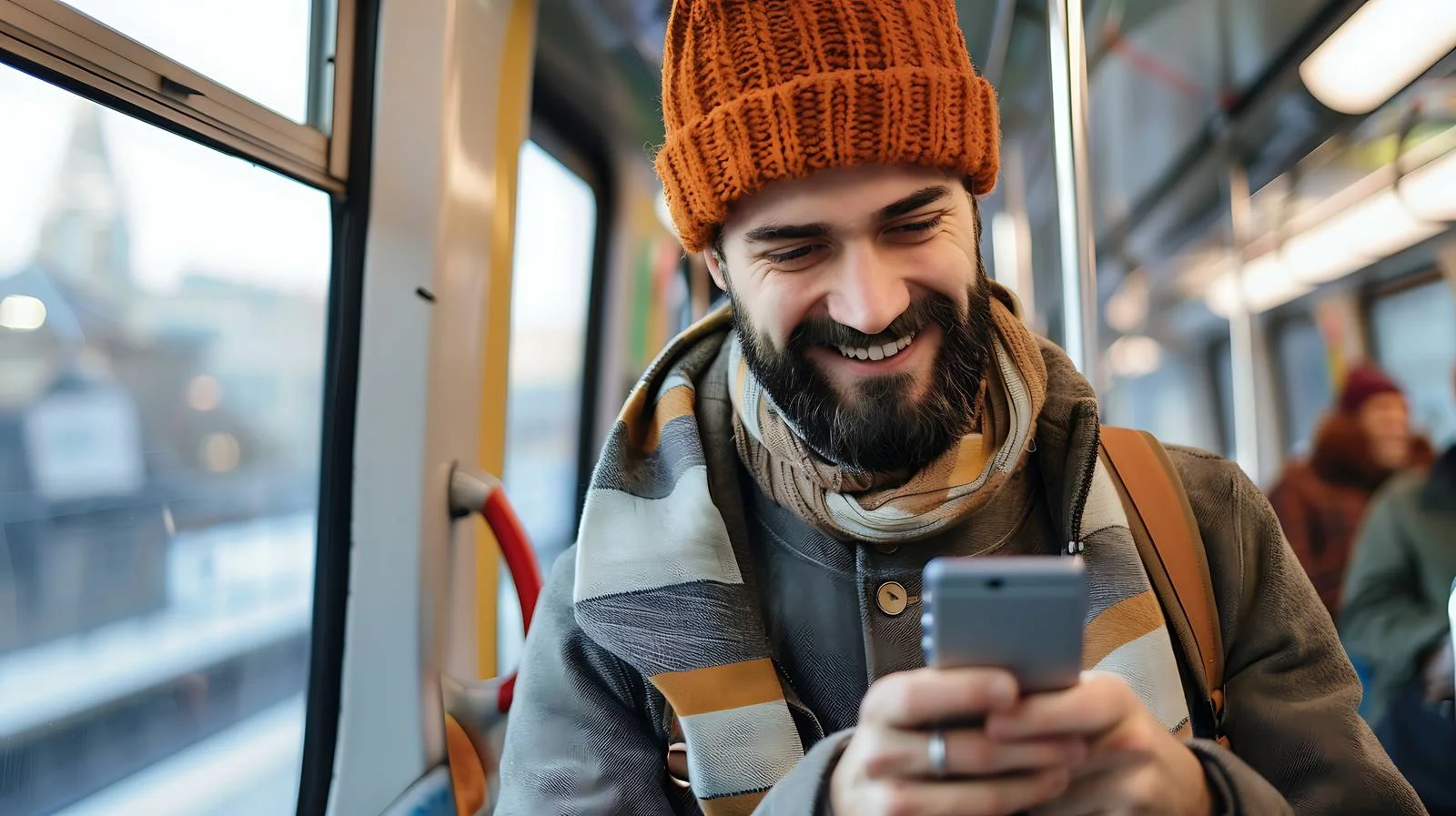 Stylish young guy happily texting on cellphone — free download from Dotvec