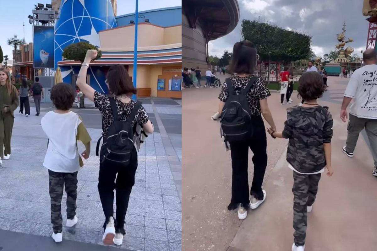Sandy e filho na Disney