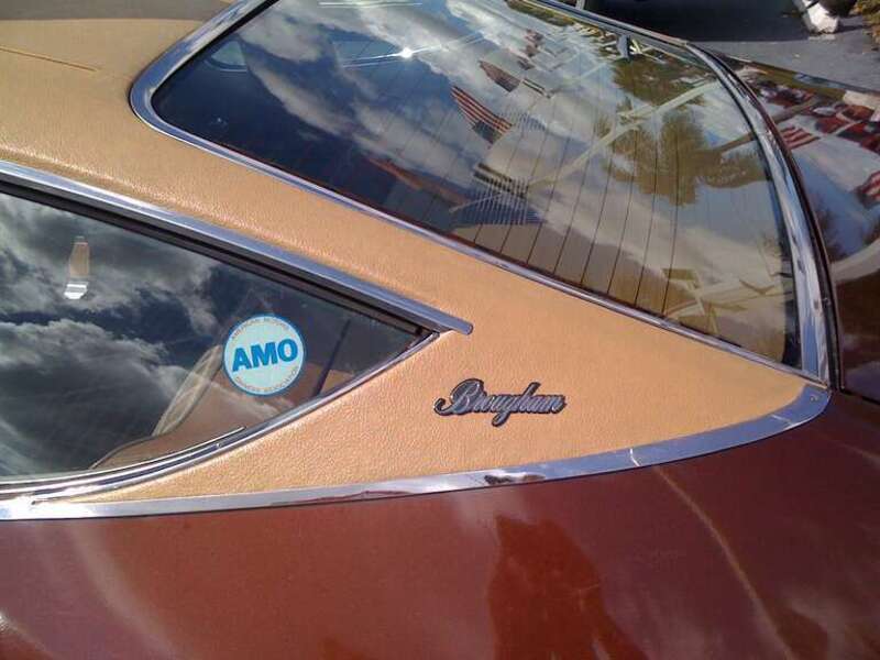 1976 AMC Matador Coupe - Brougham. Finished in Dark Cocoa Metallic (paint code: H4) with factory optional vinyl roof cover. Detail of "C-pillar with model nameplate.