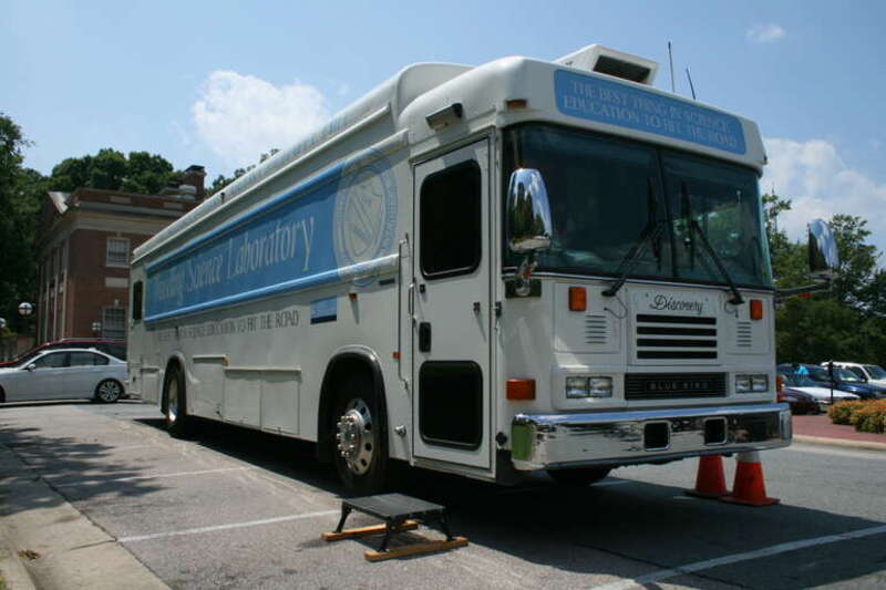 UNC's Traveling Science Laboratory Blue Bird bus parked at the Morehead Planetarium and Science Center in Chapel Hill, North Carolina. This bus is "Discovery," a member of the DESTINY fleet. These busses are part of a science education program which