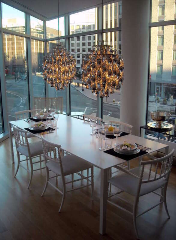 A dining table in 22 West, a luxury condominium, located in the West End neighborhood of Washington, D.C.
The intersection of 22nd Street, M Street, and New Hampshire Avenue, N.W., is visible in the background.
The 92-unit, 11-story, condominium was