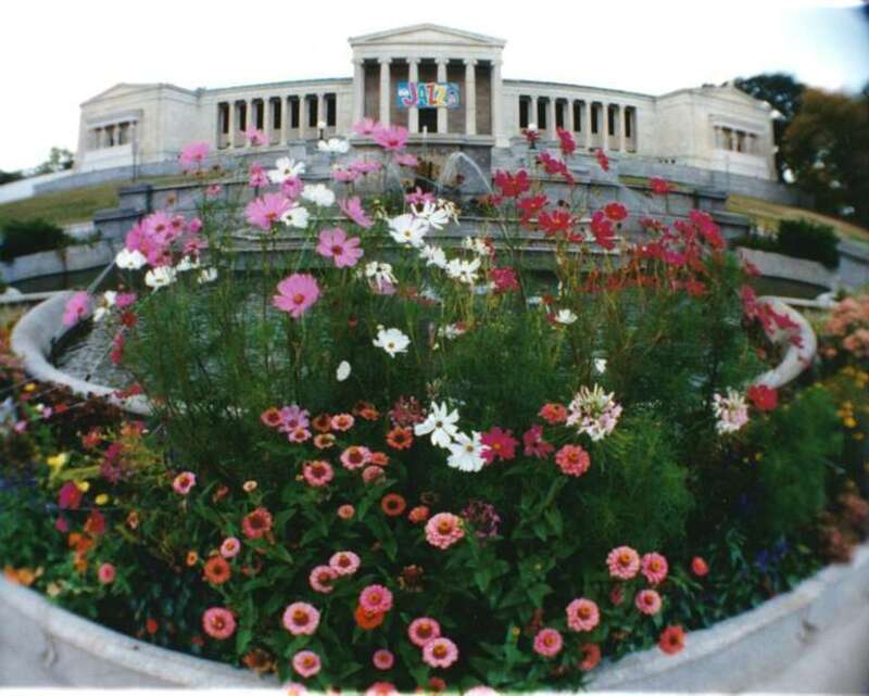 Albright-Knox Art Gallery, East face; impatients growing in the fountain garden.  The "Jazz" banner is for a local Jazz festival.