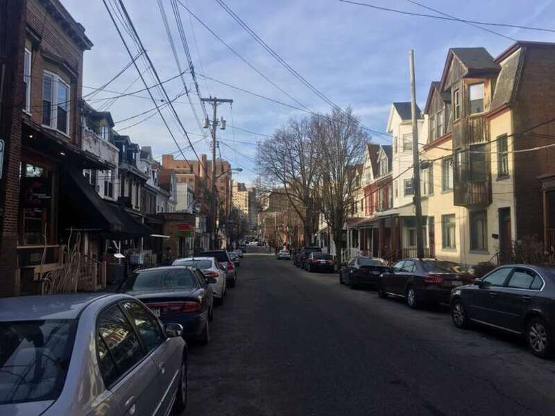 Looking northwestward down Atwood Street from between Bates and Louisa Streets in the Oakland area of Pittsburgh, PA, December 2019. The University of Pittsburgh Medical Center is seen in the background.