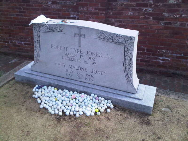 The grave of Bobby Jones (golfer) in historic Oakland Cemetery in Atlanta, Georgia.  Note the golf hole to the lower right.  Text: "Robert Tyre Jones, Jr. / March 17, 1902 / December 18, 1971 / Mary Malone Jones / July 24, 1902 / May 23, 1975"