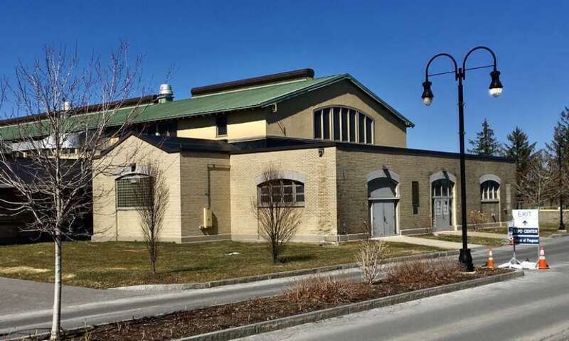 As seen in March 2021. Although the main façade of the Cattle Building eschews the High Neoclassical style employed by the Buffalo firm of Green &amp; Wicks on the other buildings they designed for the New York State Fairgrounds in favor of an Arts