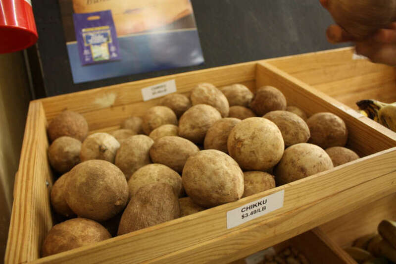 Chikku aka sapodilla. This looks like a potato, but it's a fruit. Bladholm says "The flesh is translucent honey brown to reddish yellow with a slightly granular texture. Juicy and fragrant, the sweet honey-pear flesh melts in your mouth."  For best