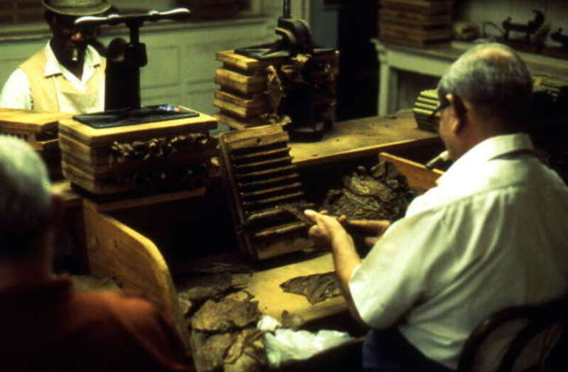 Local call number: FS85691Title: Cuban cigar makers at work: Ybor City, FloridaDate: 1974Photographer: http://www.floridamemory.com/solr-search/results/?q=collection:%22Florida Photographic Collection" AND photographer:"Loomis, Ormond H.,