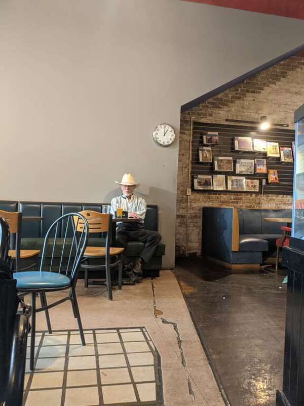 Customer sits with a beer at Taylor Books, 226 Capitol Street in downtown Charleston, West Virginia on the Fourth of July.