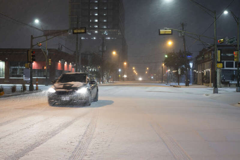 A car driving in the Dallas snow 2021