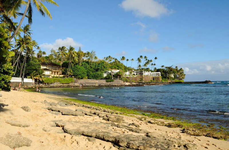 At the end of this beach. On the other side is Kahala beach. The building on the right is the Shangri La Islamic Art Museum.