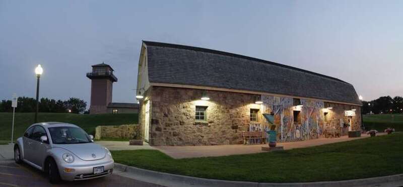 This is the Horse Barn where art shows are staged at Falls Park.  Oh yeah, thats my silver Beetle too.  Heh heh!