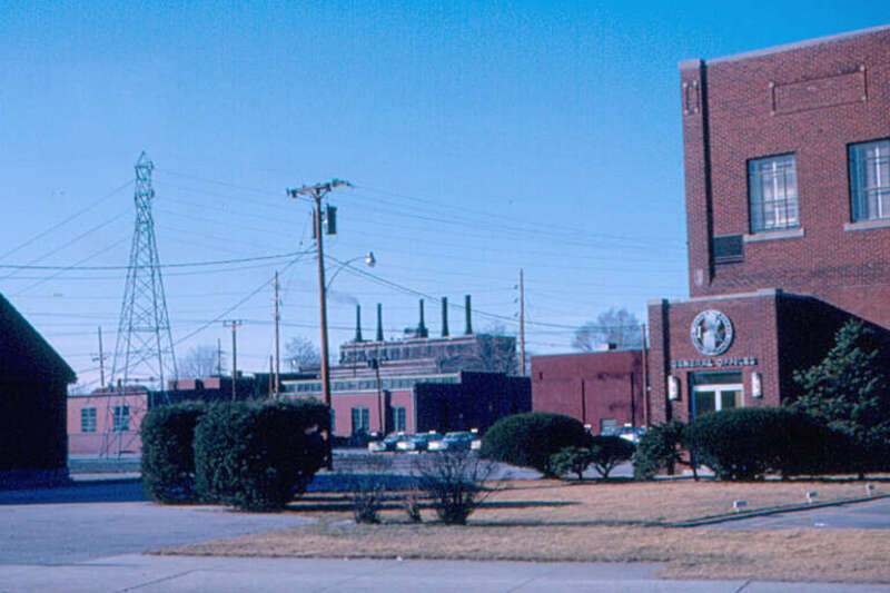 The general office of Indiana &amp; Michigan Electric Co. is at right.  The company was headquartered in Fort Wayne, but electric power in the city was supplied by a city-owned utility, called City Light.  Their power plant is in the background.