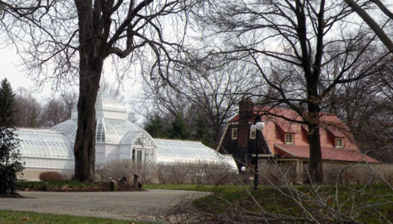 Picture of the greenhouse at the Frick Art &amp; Historical Center in the Point Breeze neighborhood of Pittsburgh, Pennsylvania, on March 21, 2010.  The little house to the right of the greenhouse is the "playhouse" for the Frick children, which was