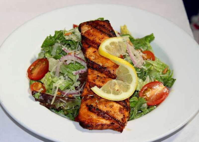 Perfectly grilled salmon filet, cut fresh daily and dipped in Elaine’s Marinade, served on Classic Caesar salad
The LEMON LEAF Cafe
Historic Down Town Lancaster
653 W. Lancaster Boulevard
Lancaster, CA 93534
<a href="http://www.lemonleaf.com"