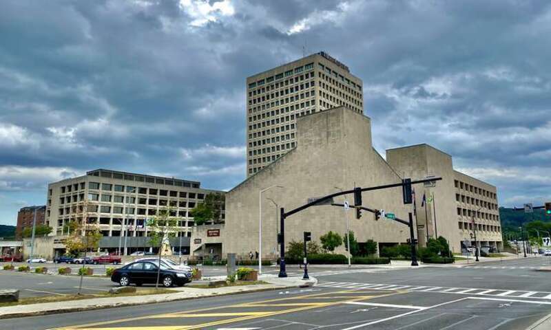 As seen in July 2022, Government Plaza is the name for the cluster of office buildings on the south side of Hawley Street between State and Isbell Streets in downtown Binghamton, New York. Inaugurated in 1972, this U-shaped complex has the Edwin L.