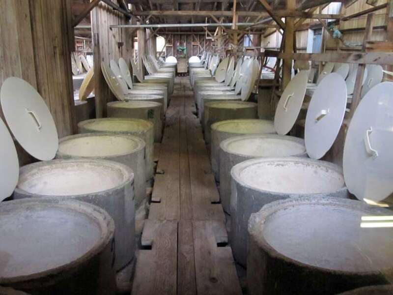 Photo of the olive vat room at Graber Olive House, 315 E 4th St, Ontario, CA 91764. In 1894, two years after planting olive trees in Ontario, California, C. C. Graber began selling vat cured olives from the pictured vat room in vats similar to the