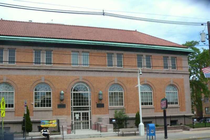 Looking west at the Greenville libary and museum on a mostly cloudy morning.