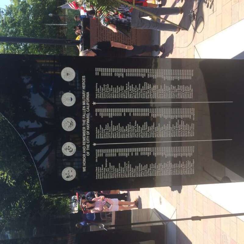 the obverse side of one of 5 black granite columns of the Hayward 9/11 memorial, showing fallen hayward soldiers from the spanish american war to the present. dedication ceremony, may 30, 2016, Hayward, California