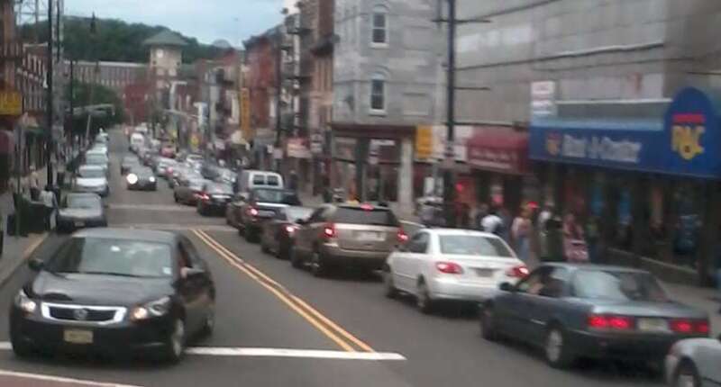 Westbound rush hour traffic in downtown Paterson, New Jersey, USA. Taken at the corner of Main St. &amp; Market St. facing WSW on Market St.
