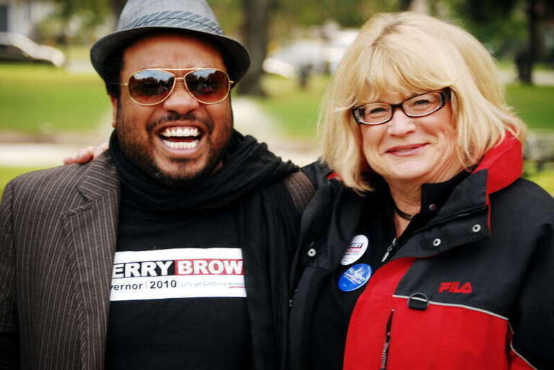 Cindy Harris, Event Coordinator and Volunteer Campaign Coordinator for Jerry Brown, makes nice with Nicholas Hatten at the Jerry Brown rally in Victory Park, Stockton. Three days to go before the election &amp; the push is on...