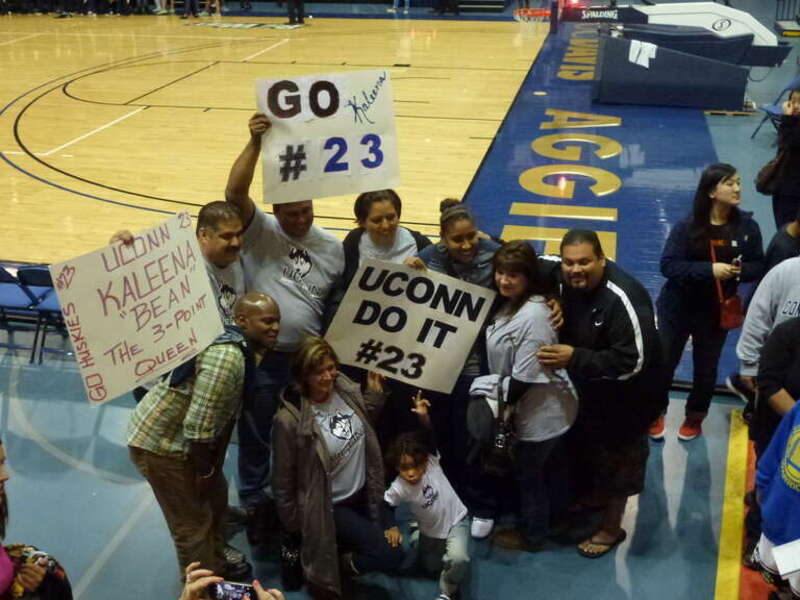 Kaleena Mosqueda -Lewis surrounded by friends and family after the UC Davis game where she tied the UConn record with ten three pointers made in a single game. She shares the record with Maya Moore
