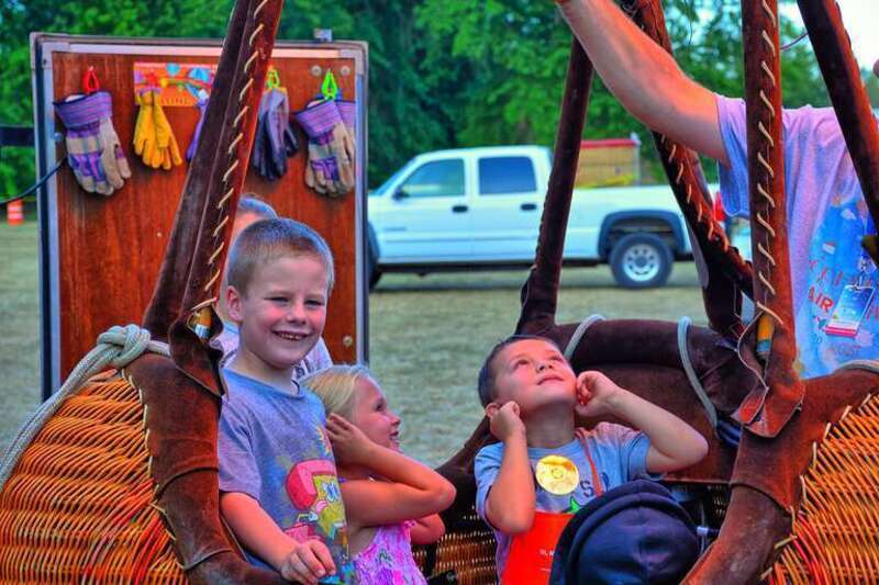 Logan so wanted to go for a ride.  One of the ballooners was so kind as to allow some of the kids into a Gondola and light it up so they could see and feel the heat off the burner.

Published at:  <a