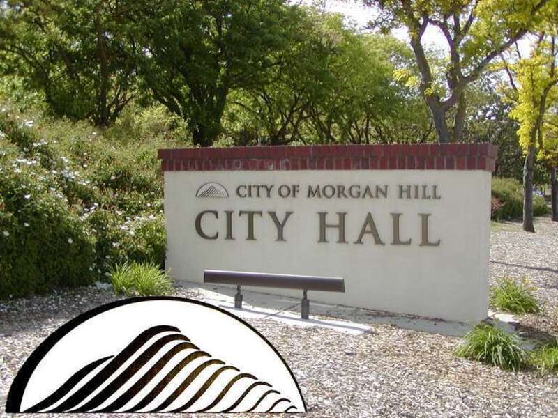 Sign at Civic Center, Morgan Hill, California, U.S.A., illustrating incorporation of El Toro, a local geographic feature, into the design of the city logo.  (composite image)