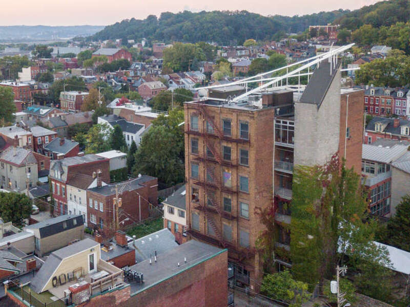 The Mattress Factory main building with light installation "Acupuncture" by Hans Peter Kuhn.