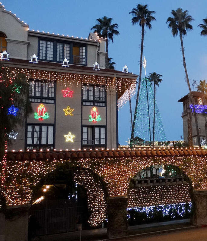 (1 in a multiple picture album)
Seen here is the south side of the hotel's west wing. Just enough lights are added to give it a Christmas Cheer look. The courtyard is to the right and the campanile is seen on the right edge of the picture.