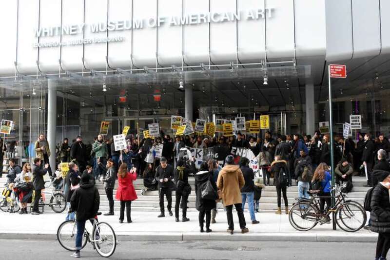 Demonstrating outside the Whitney Museum, demanding the museum take down the “Open Casket” painting of Emmett Till.