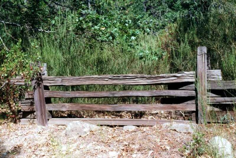 (1 of a multiple picture set.)
Sometimes the simplest of things make an impression on me.  This old fence stood along a back road leading to Castle Crags State Park, up near Mt. Shasta. At one time there was obviously a pasture or a field behind it,
